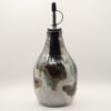 Ceramic oil bottle with metallic silver, black, green and reddish-brown drip glaze and a steel pour spout with black cap