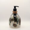IMG_4203 Ceramic soap dispenser with black, green and brown drips over cream glaze, a cork stopper and black pump