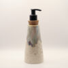 IMG_4205 Tapered ceramic soap dispenser in speckled cream glaze with blue, purple and amber drips at the top, cork collar and black pu